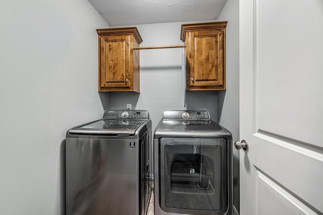701 Lexington Cir, Clever, MO 65631 - washroom featuring independent washer and dryer and cabinet space