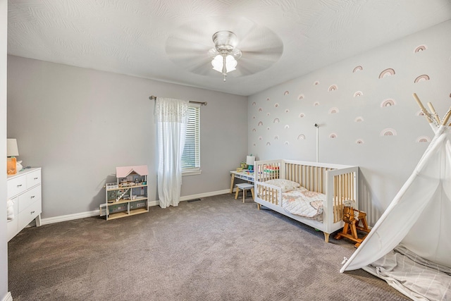 701 Lexington Cir, Clever, MO 65631 - carpeted bedroom featuring a nursery area and ceiling fan