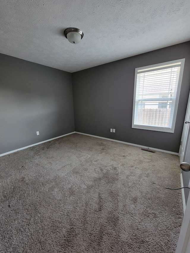 100 Hawthorn Ave, Rogersville, MO 65742 - carpeted empty room featuring baseboards and a textured ceiling