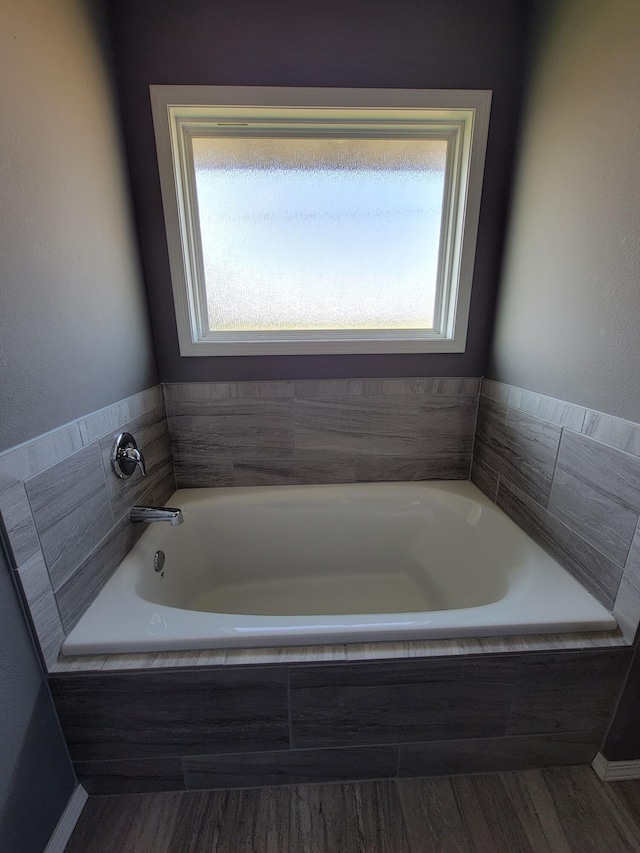 100 Hawthorn Ave, Rogersville, MO 65742 - bathroom with a bath and wood finished floors