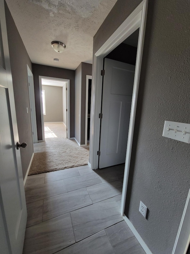 100 Hawthorn Ave, Rogersville, MO 65742 - hall with a textured wall and a textured ceiling