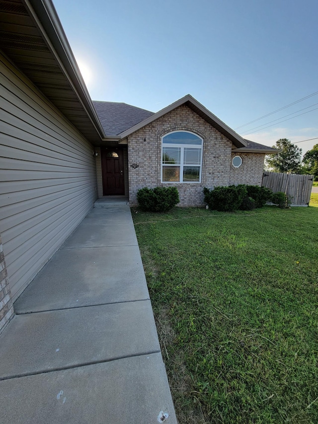100 Hawthorn Ave, Rogersville, MO 65742 - doorway to property with brick siding and roof with shingles