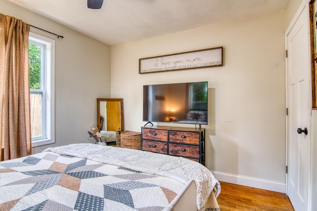 135 Roark Ave, Branson, MO 65616 - bedroom with wood finished floors and ceiling fan