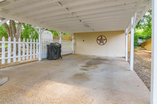 135 Roark Ave, Branson, MO 65616 - view of patio / terrace featuring a grill, a storage unit, and an attached carport