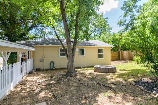 135 Roark Ave, Branson, MO 65616 - back of house with an outdoor fire pit and a fenced backyard