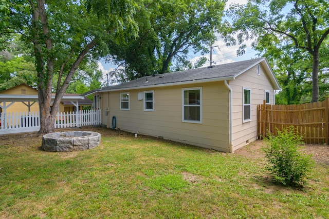 135 Roark Ave, Branson, MO 65616 - rear view of house featuring a fire pit