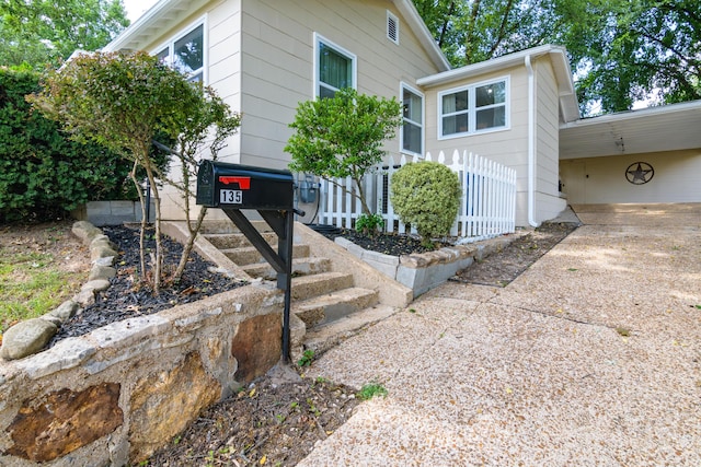 135 Roark Ave, Branson, MO 65616 - view of front of home with concrete driveway and an attached carport