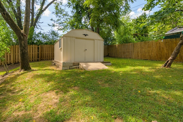 135 Roark Ave, Branson, MO 65616 - fenced backyard featuring a storage unit