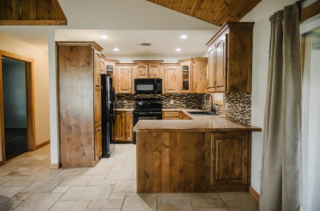 22783 Lawrence Unit 1210, Aurora, MO 65605 - kitchen with black appliances, lofted ceiling, backsplash, a peninsula, and glass insert cabinets