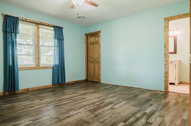 22783 Lawrence Unit 1210, Aurora, MO 65605 - unfurnished bedroom featuring wood finished floors, connected bathroom, and ceiling fan