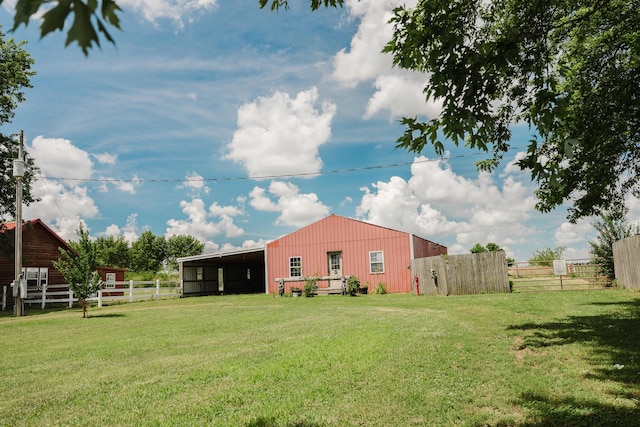 22783 Lawrence Unit 1210, Aurora, MO 65605 - rear view of property with an outbuilding
