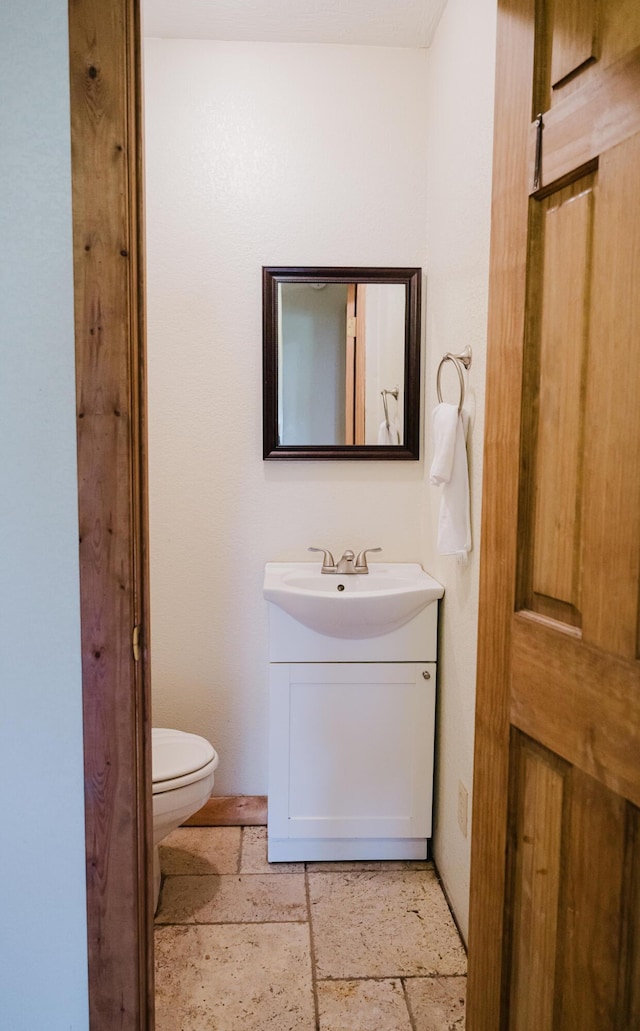 22783 Lawrence Unit 1210, Aurora, MO 65605 - half bathroom with vanity and stone tile floors