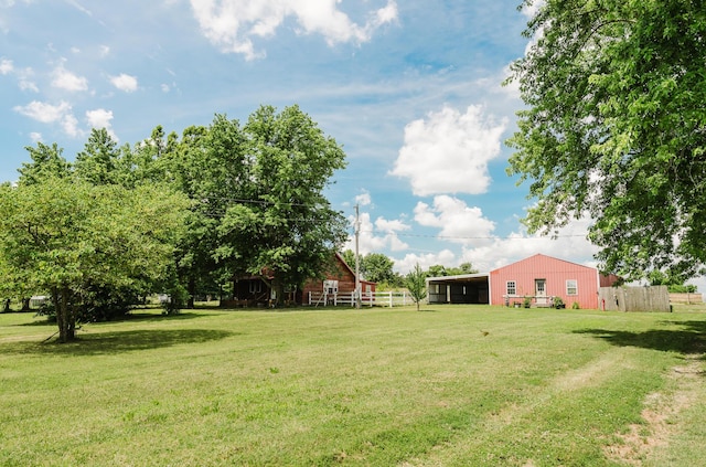 22783 Lawrence Unit 1210, Aurora, MO 65605 - view of yard featuring a pole building, an outdoor structure, and an attached carport