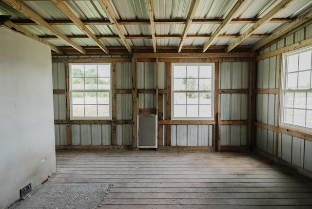 22783 Lawrence Unit 1210, Aurora, MO 65605 - spare room featuring healthy amount of natural light and hardwood / wood-style floors