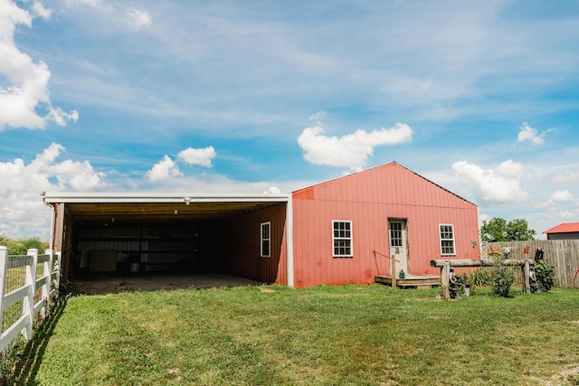 22783 Lawrence Unit 1210, Aurora, MO 65605 - back of house featuring a pole building, an outbuilding, and a carport