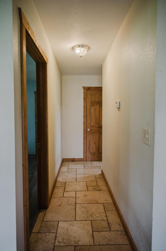 22783 Lawrence Unit 1210, Aurora, MO 65605 - hallway with stone tile floors and baseboards
