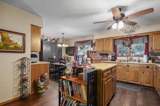 667 S Broadview Dr, Springfield, MO 65809 - kitchen with brown cabinets, dark wood-style floors, a ceiling fan, a textured ceiling, and open shelves