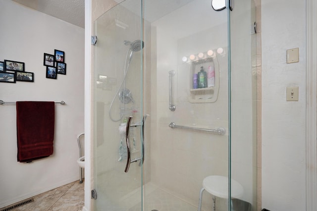 667 S Broadview Dr, Springfield, MO 65809 - bathroom with a stall shower, a textured ceiling, and tile patterned flooring
