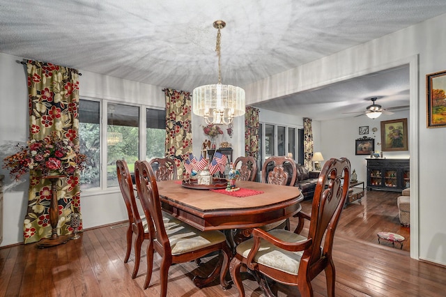 667 S Broadview Dr, Springfield, MO 65809 - dining room with a chandelier, hardwood / wood-style flooring, and a ceiling fan