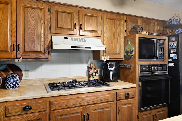 667 S Broadview Dr, Springfield, MO 65809 - kitchen with black appliances, custom exhaust hood, brown cabinets, and backsplash