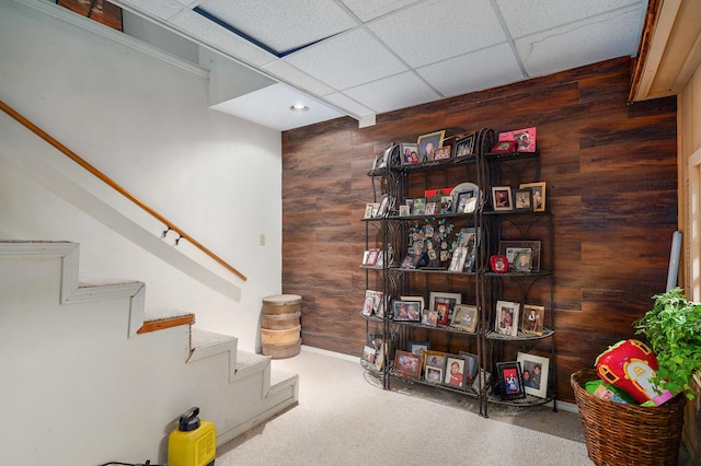 667 S Broadview Dr, Springfield, MO 65809 - stairs with wooden walls, a drop ceiling, and recessed lighting