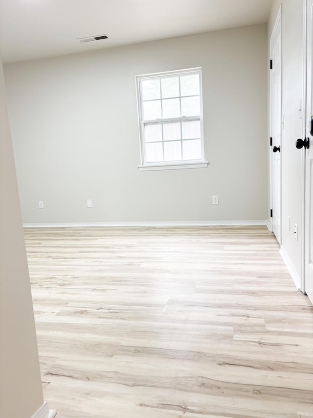 905 NW Blvd, Neosho, MO 64850 - unfurnished room with light wood-style flooring and baseboards