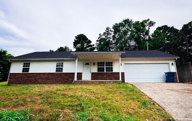 905 NW Blvd, Neosho, MO 64850 - ranch-style home featuring brick siding, driveway, a garage, and a front lawn