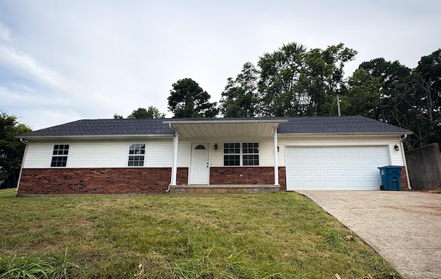 905 NW Blvd, Neosho, MO 64850 - ranch-style home featuring brick siding, driveway, an attached garage, and a front yard