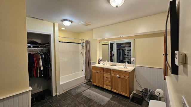 5143 State Highway 95, Drury, MO 65638 - full bathroom featuring shower / bathtub combination with curtain, double vanity, a spacious closet, and tile patterned flooring