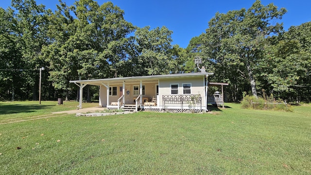 5143 State Highway 95, Drury, MO 65638 - view of front facade with a front lawn, covered porch, and a chimney