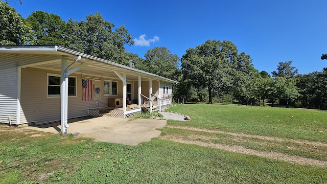 5143 State Highway 95, Drury, MO 65638 - view of side of home with a yard, an attached carport, and a porch