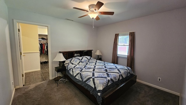 5143 State Highway 95, Drury, MO 65638 - carpeted bedroom with a walk in closet and a ceiling fan