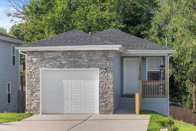 310 W College St, Branson, MO 65616 - view of front of property featuring roof with shingles, stone siding, and driveway