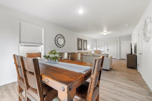 310 W College St, Branson, MO 65616 - dining room with light wood finished floors and baseboards