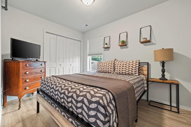 310 W College St, Branson, MO 65616 - bedroom featuring wood finished floors and a closet