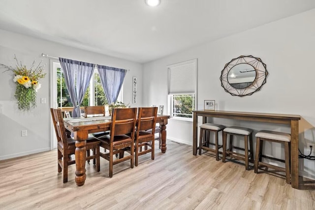 310 W College St, Branson, MO 65616 - dining room with wood finished floors and baseboards
