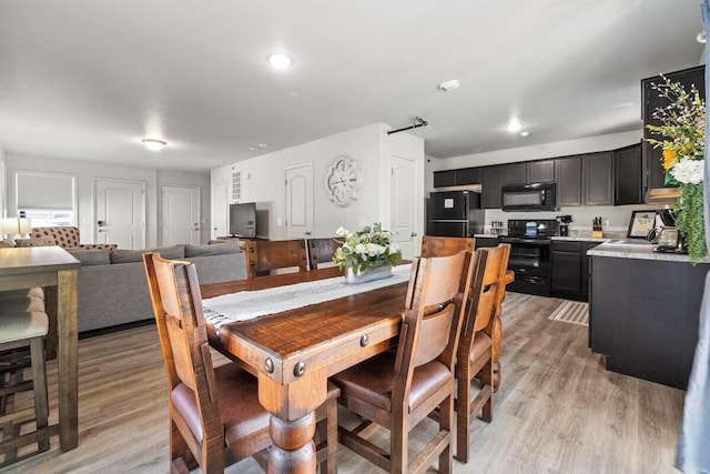 310 W College St, Branson, MO 65616 - dining room with light wood-style floors and recessed lighting