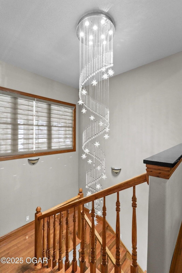 318 Fox Fire Ct, Joplin, MO 64801 - stairs featuring a chandelier and wood finished floors