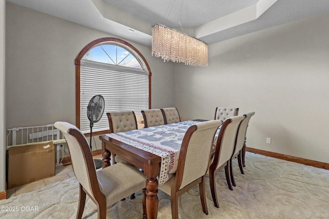 318 Fox Fire Ct, Joplin, MO 64801 - carpeted dining room featuring a chandelier and a raised ceiling