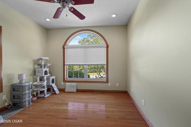 318 Fox Fire Ct, Joplin, MO 64801 - interior space featuring ceiling fan, a textured ceiling, wood finished floors, and recessed lighting