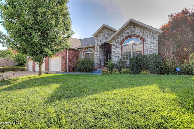 318 Fox Fire Ct, Joplin, MO 64801 - french provincial home with stone siding, a front yard, driveway, and a garage