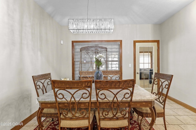318 Fox Fire Ct, Joplin, MO 64801 - dining area with a chandelier and light tile patterned floors