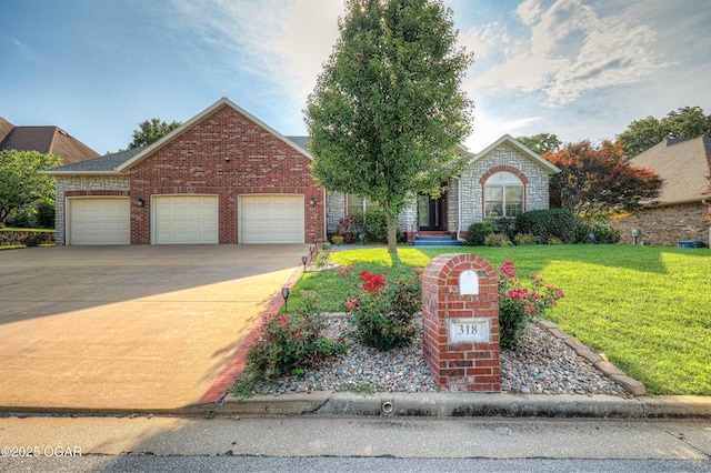 318 Fox Fire Ct, Joplin, MO 64801 - view of front of property featuring an attached garage, a front yard, driveway, and brick siding