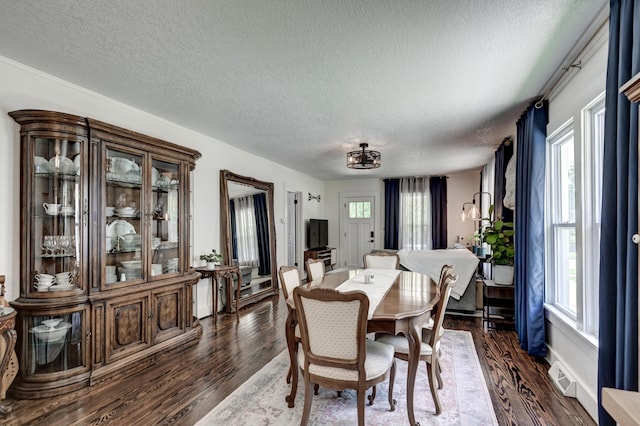 1508 S Moffet Ave, Joplin, MO 64804 - dining space with a textured ceiling and dark wood-type flooring