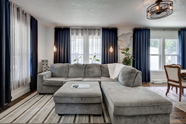 1508 S Moffet Ave, Joplin, MO 64804 - living area featuring a textured ceiling and wood finished floors