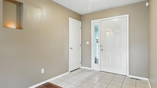 205 W Hunter Dr, Nixa, MO 65714 - foyer with baseboards and light tile patterned floors