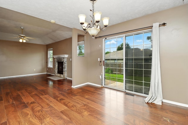 205 W Hunter Dr, Nixa, MO 65714 - unfurnished living room featuring wood finished floors, a chandelier, a fireplace, ceiling fan, and lofted ceiling