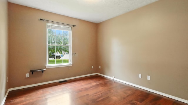 205 W Hunter Dr, Nixa, MO 65714 - unfurnished room with dark wood-style flooring and baseboards
