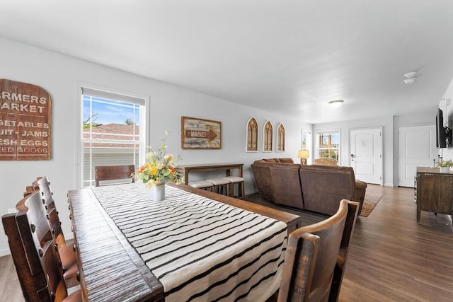 302 W College St, Branson, MO 65616 - dining room featuring healthy amount of natural light and wood finished floors
