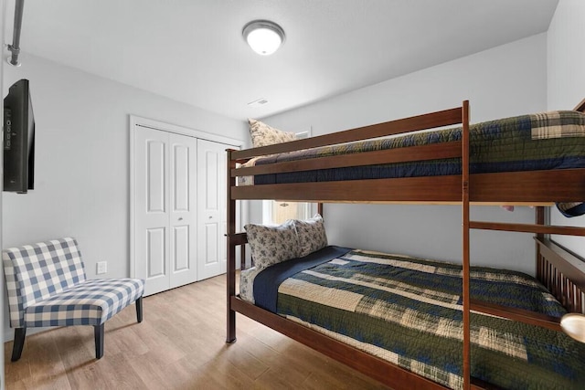 302 W College St, Branson, MO 65616 - bedroom with light wood-style flooring and a closet